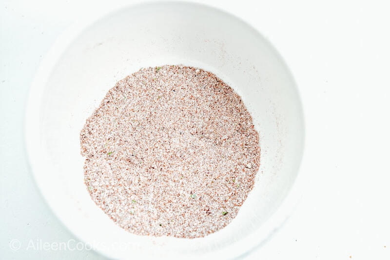Seasonings mixed together in a white bowl.