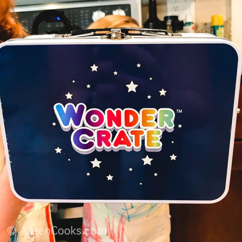 The front of the Wonder Crate tin lunch box.