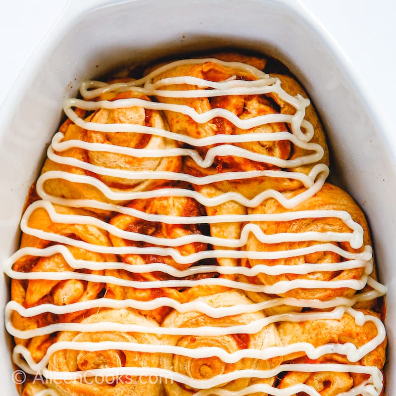 Pumpkin cinnamon rolls in a baking dish
