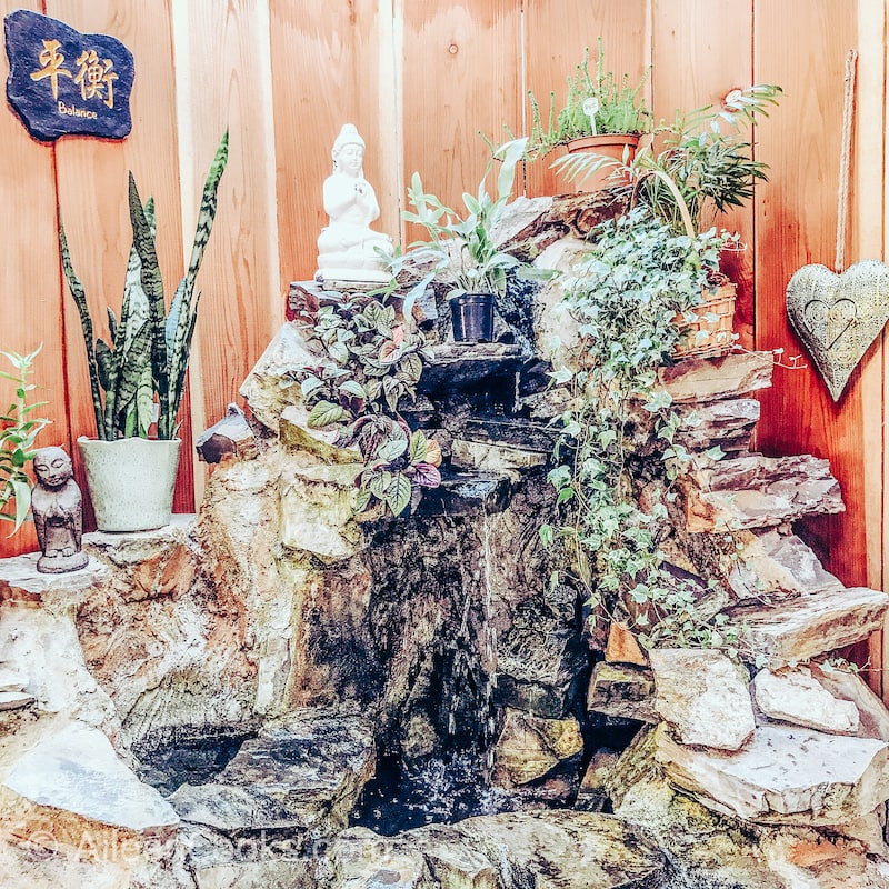 A fountain and buddha statue.