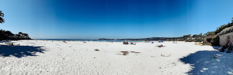 A view of the white sand beach and Pacific Ocean in Carmel by the Sea.