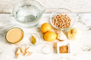 Ingredients for hummus on a white counter.