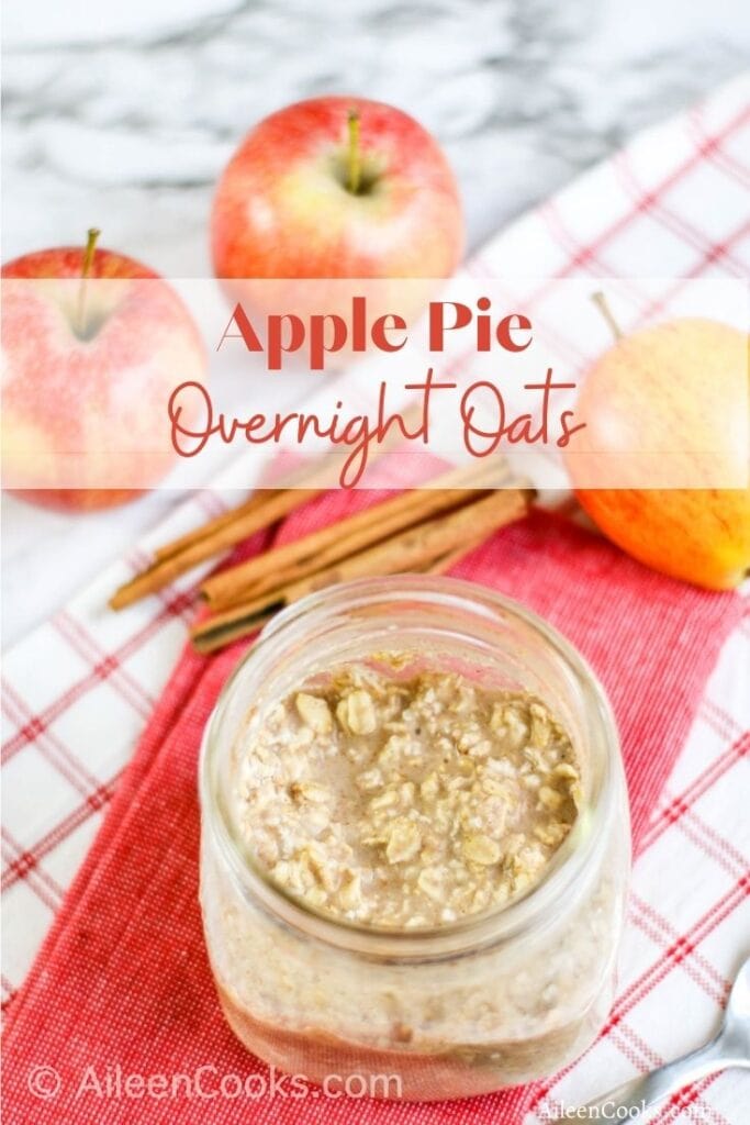 A jar of overnight oats with the words "apple pie overnight oats" in red lettering.