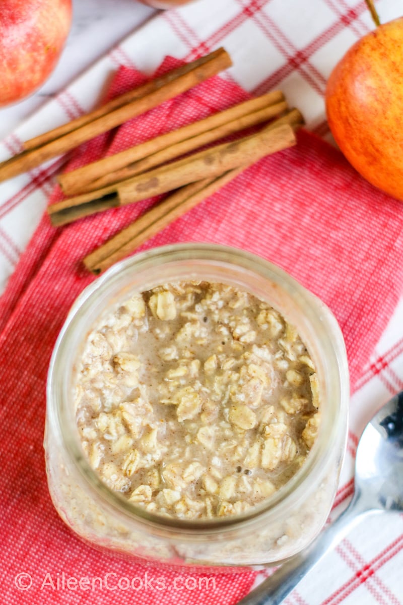 Overhead shot of overnight oats in a glass mason jar.