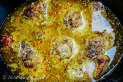 Overhead shot of lemon garlic chicken cooked inside of a slow cooker.
