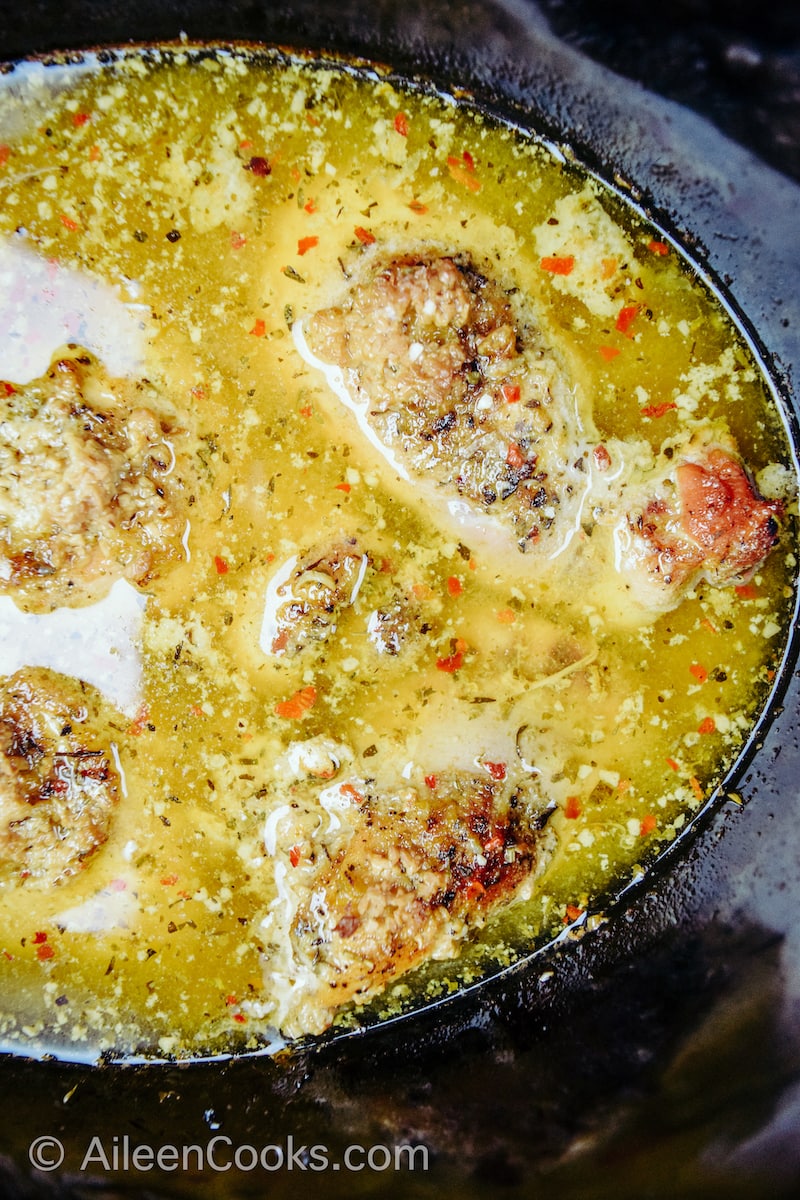 Close up of lemon garlic chicken inside crockpot.