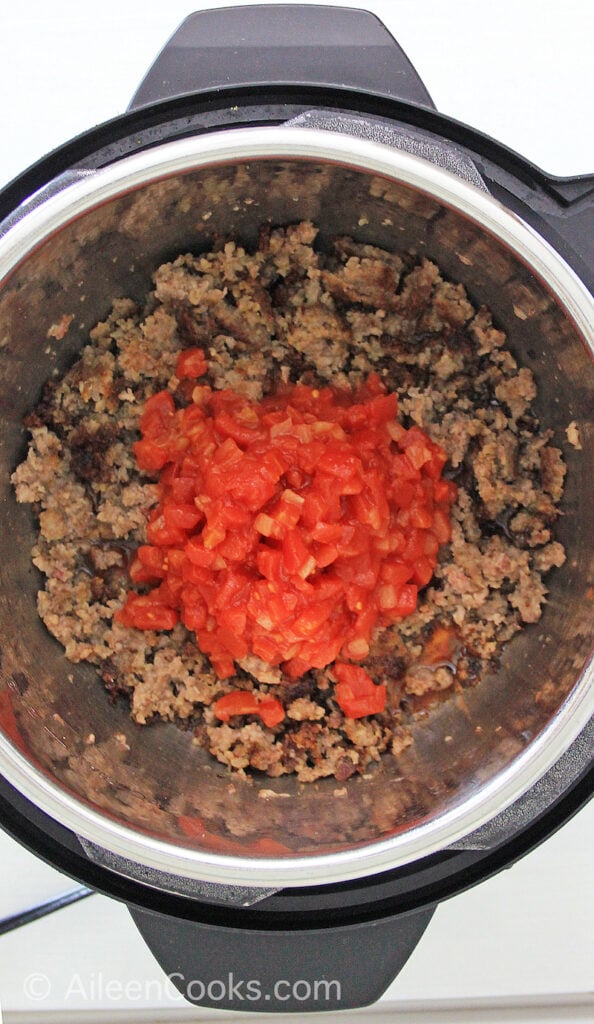 Ground beef and tomato inside of instant pot