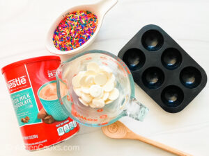 The ingredients for white chocolate hot cocoa bombs.