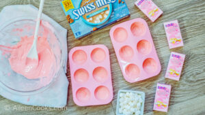 Melted pink candy melts in a bowl.