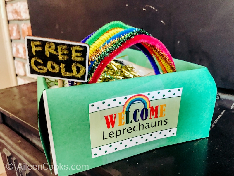 A leprechaun trap with a sign that says "free gold" poking out of the top.