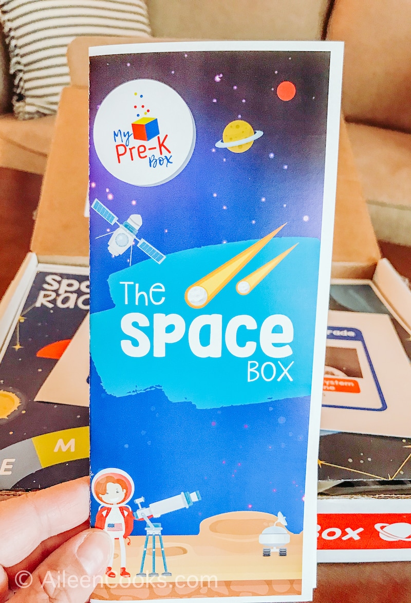 A blue pamphlet that says "The Space Box".