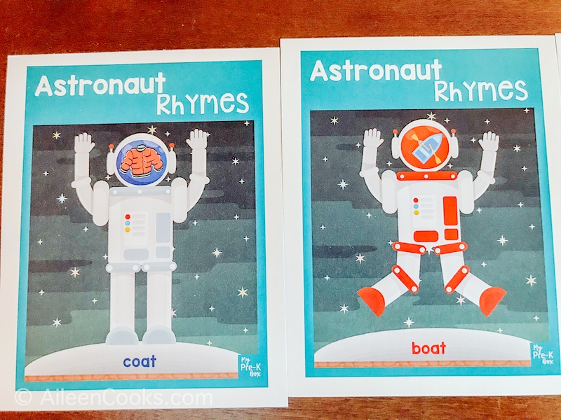 Two astronaut cards with rhyming words listed on the bottom.