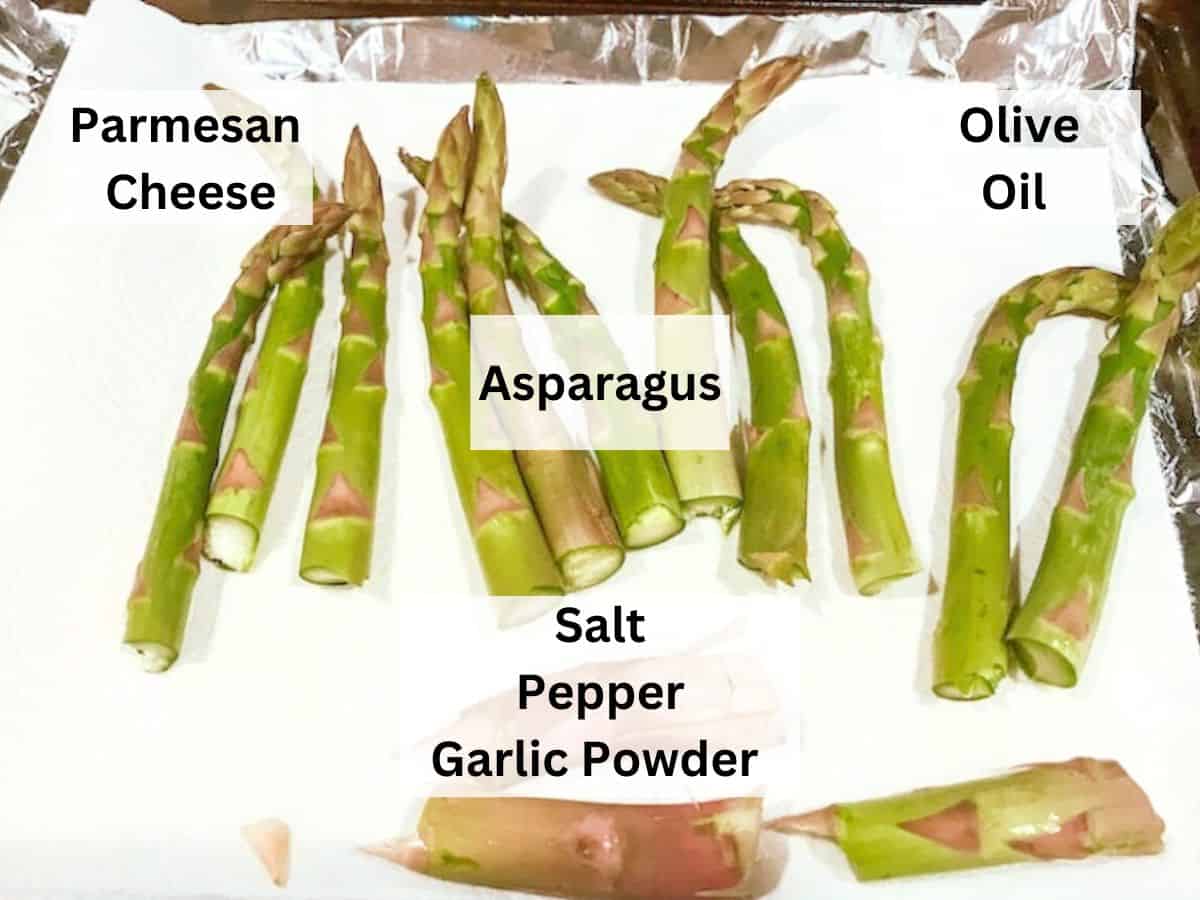 A cooking sheet filled with fresh asparagus.
