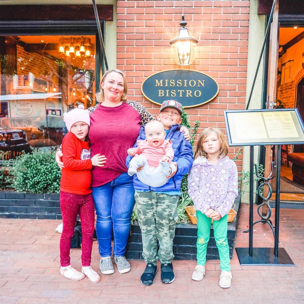 A mom and four children standing in front of Mission Bistro in Carmel.