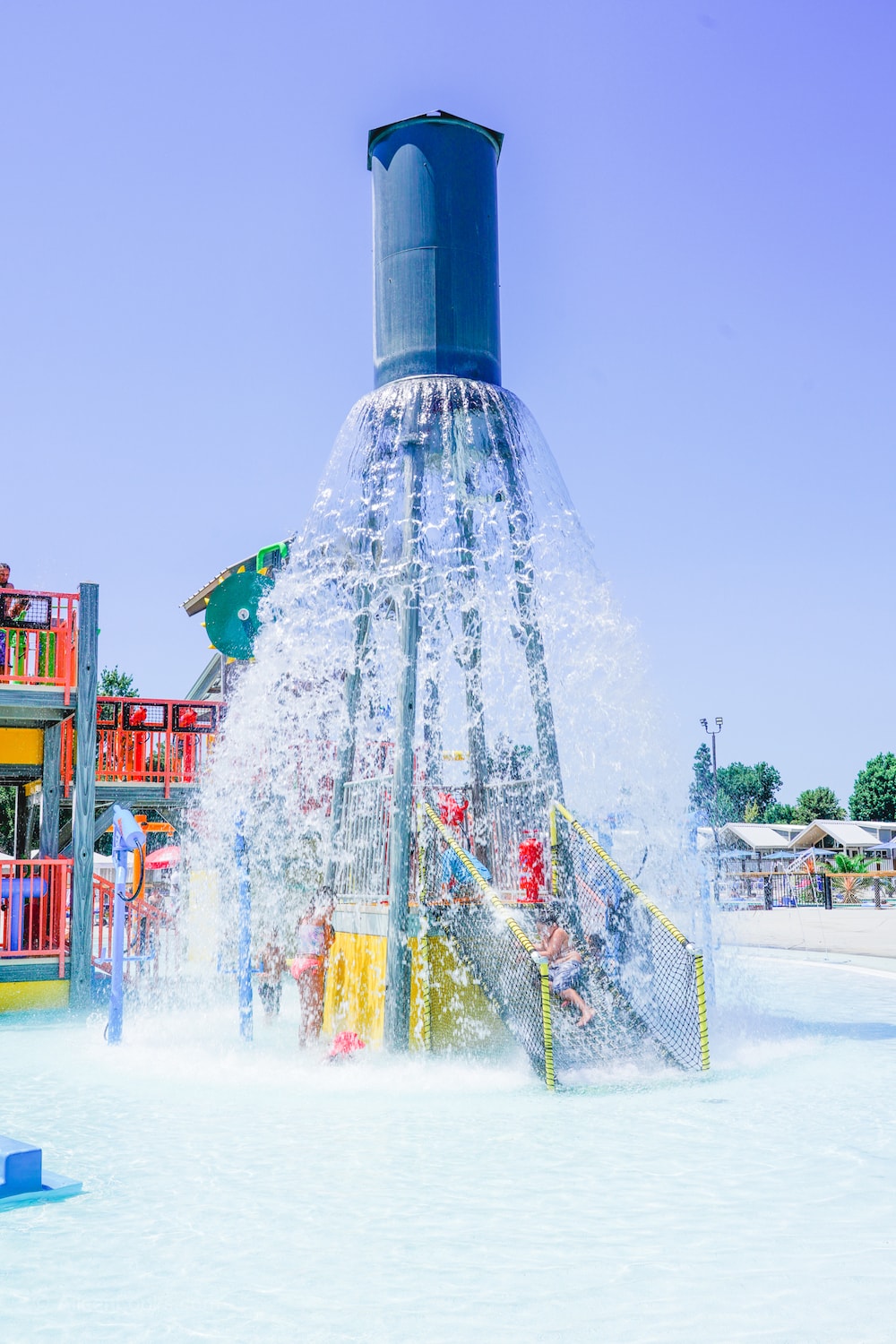 A large water feature pouring water out over a water playground at Tower Park in Lodi.