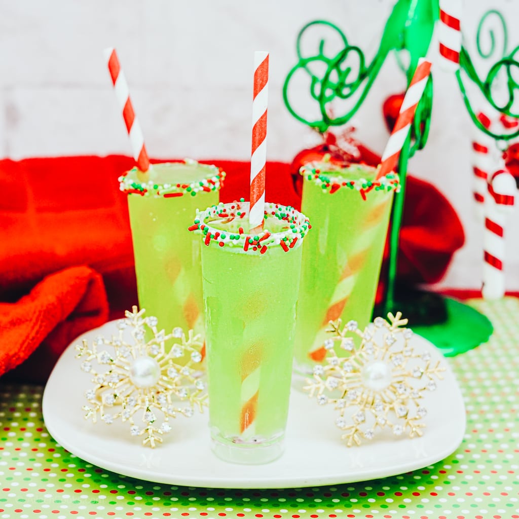 A white square plate with three green Christmas Shots. 