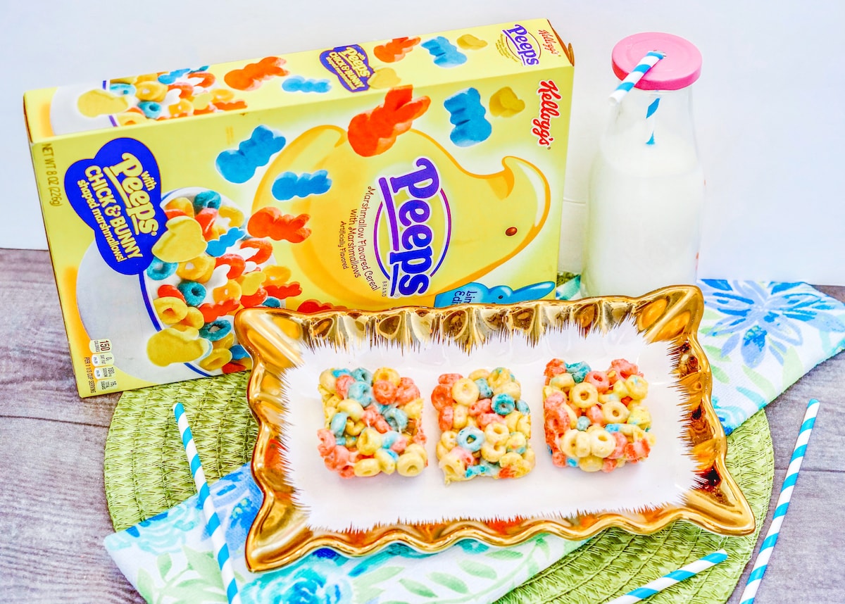 A gold platter with three colorful cereal bars.