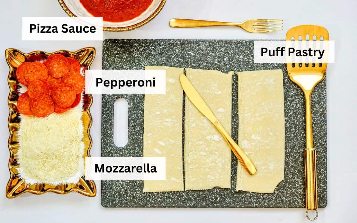 Ingredients for air fryer calzones laid out on a white counter.