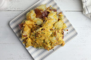 Smashed red potatoes on a square white and grey dish
