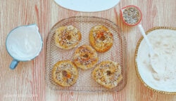 Homemade bagels, newly baked in the air fryer, sitting on a wire rack