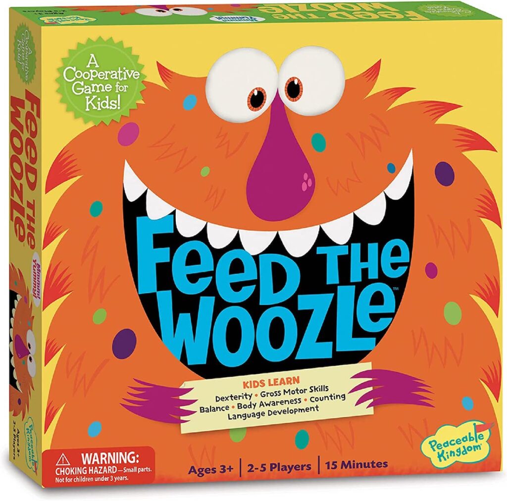 A board game with an orange monster on the cover and the words "feed the woozle" inside the monster's mouth.