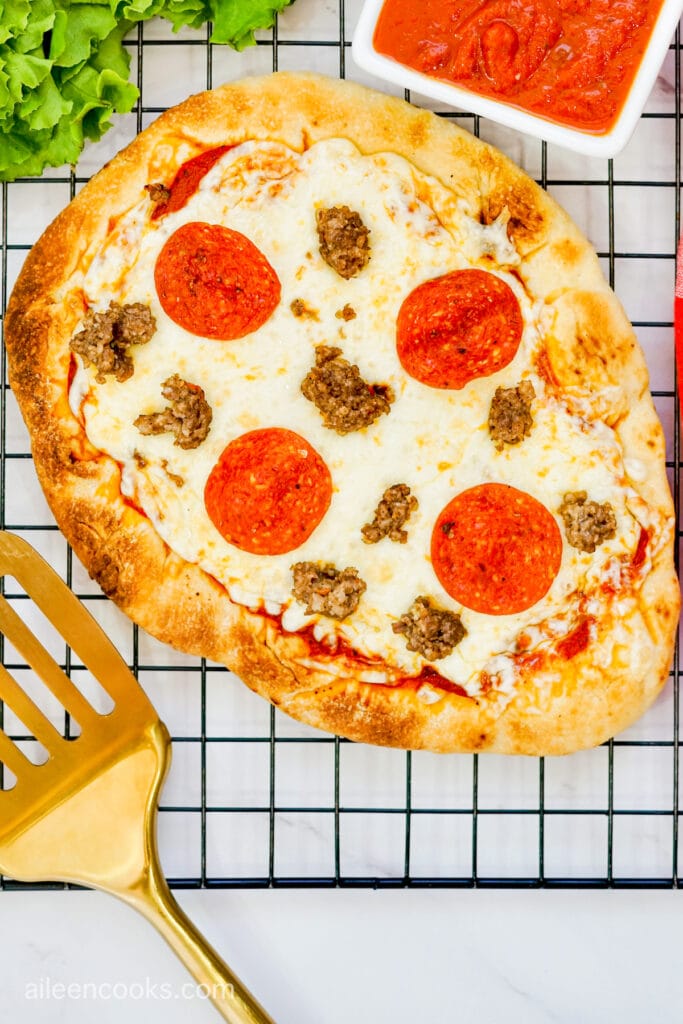 Aerial view of Grilled Flatbread Pizza, sitting on a black wire rack